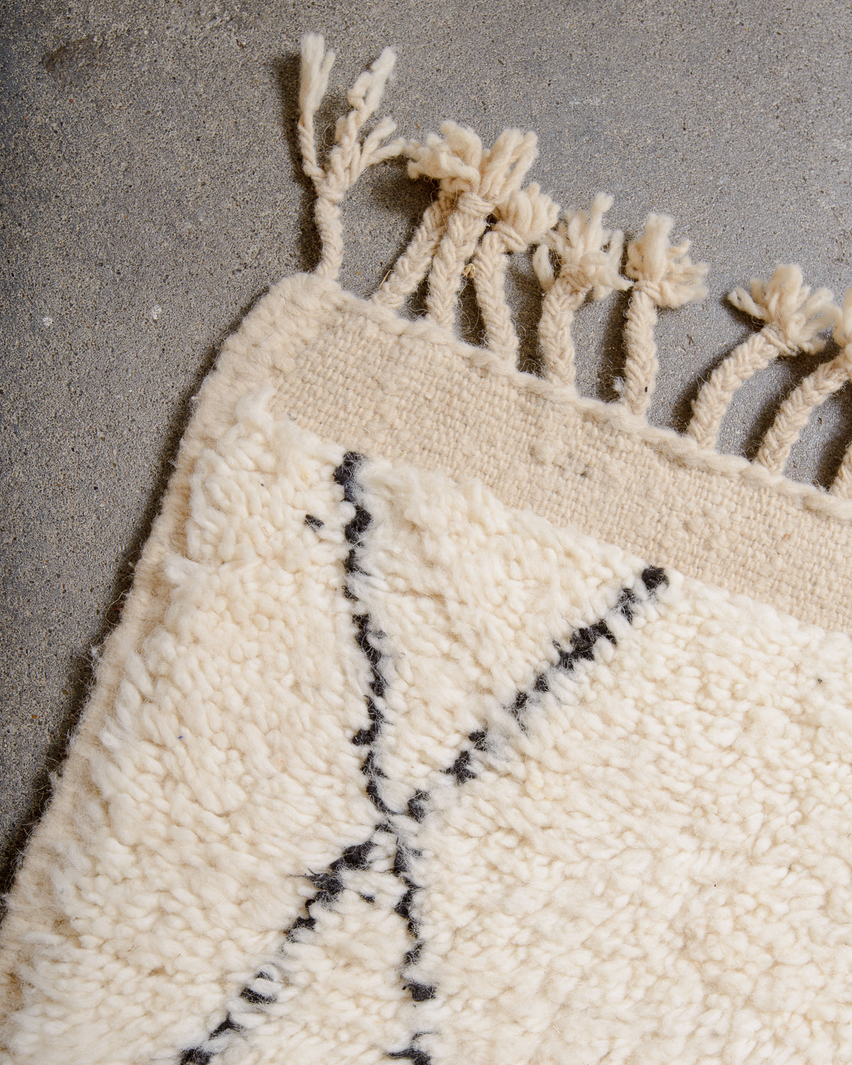 Modern, designer, handcrafted Berber rug from Morocco. Beniourain carpet with minimalist design, natural wool pile and a fluffy texture.